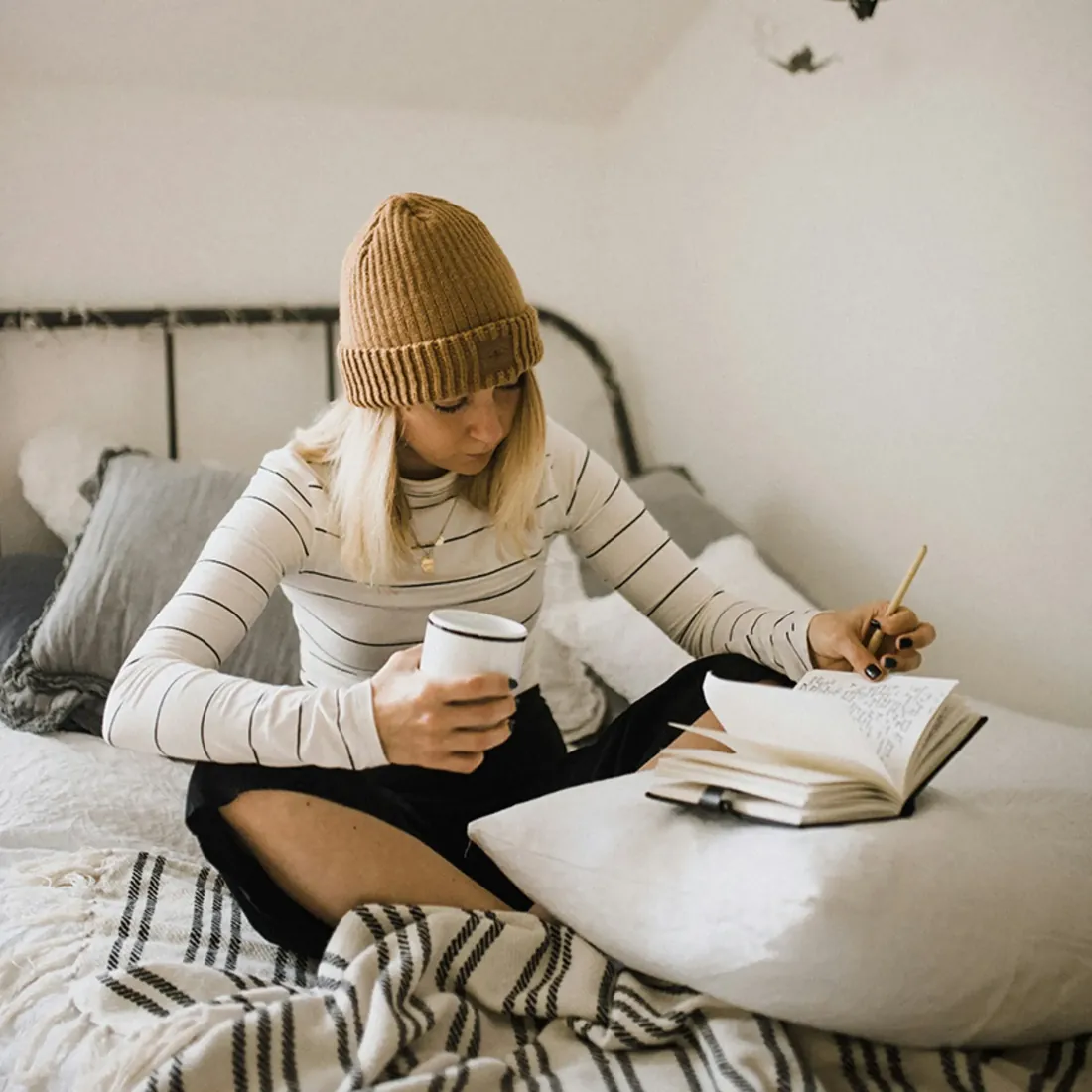 A woman journaling quietly at home