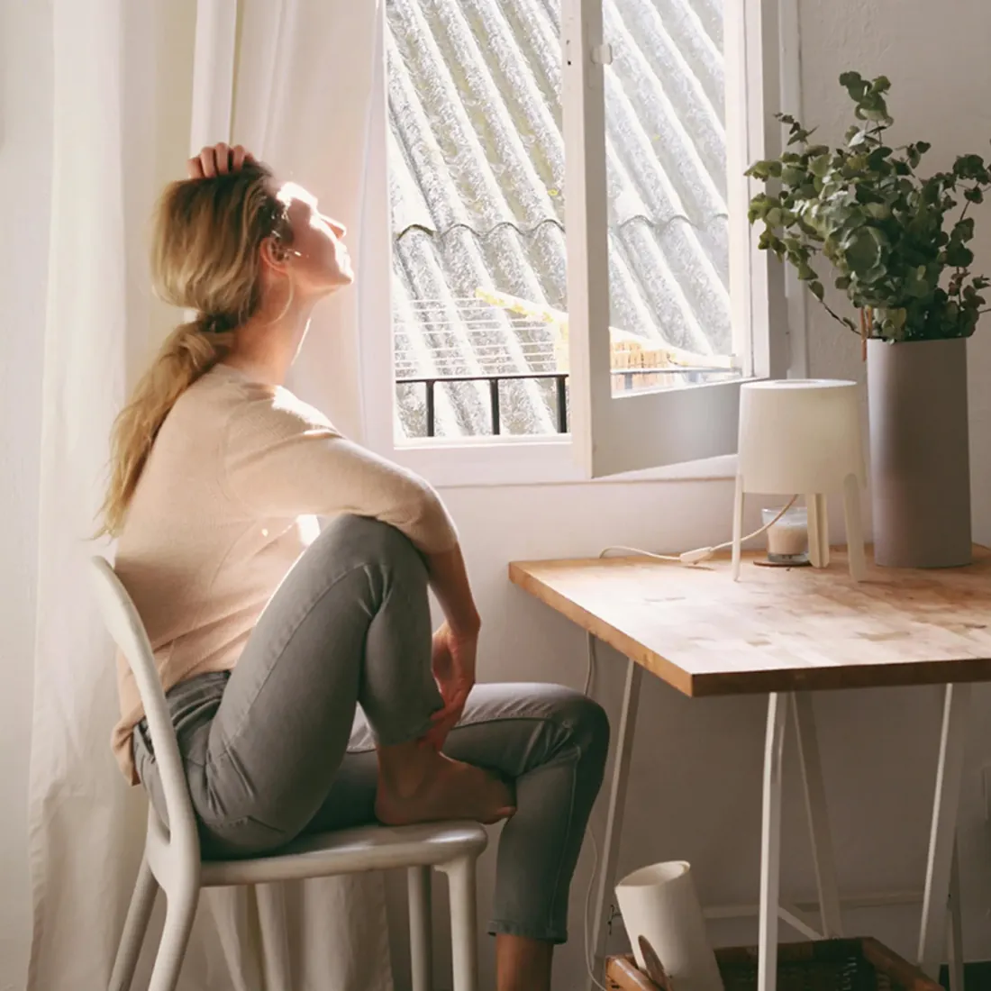 A woman looking out of a window
